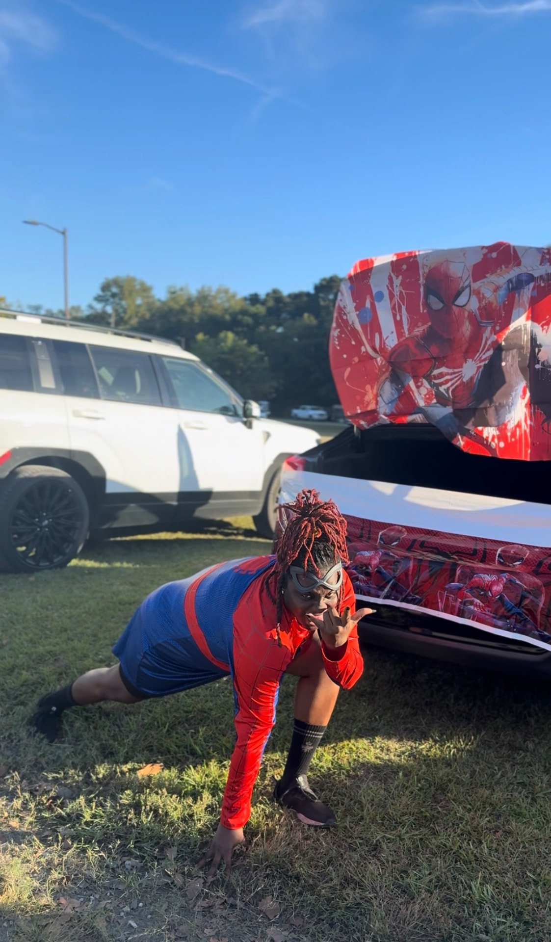 Antwonette in a Spider-Man costume at a trunk-or-treat community event
